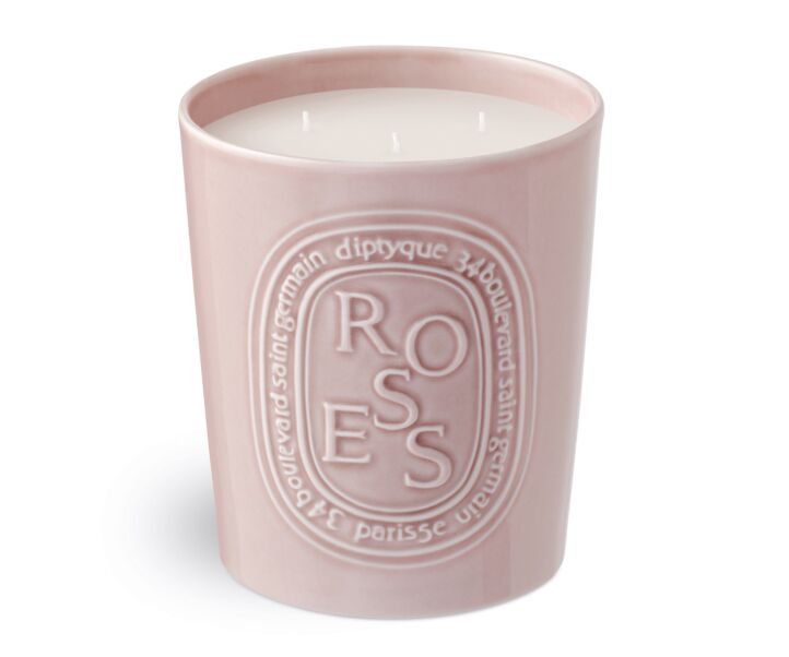 Rose scented candle in a light pink vessel