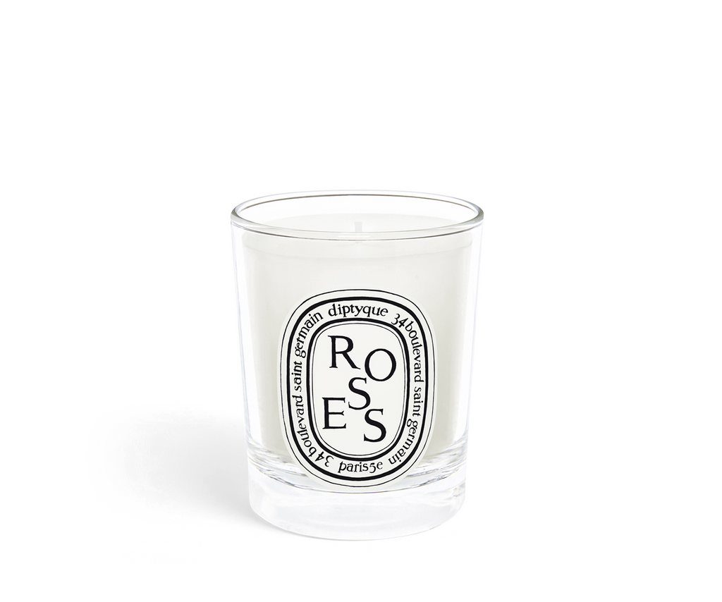 Rose scented candle in a clear glass vessel