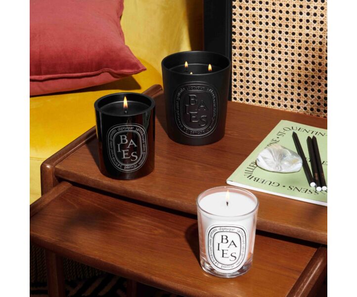 190g, 300g & 1500g Baies Candles Lit on Side Table