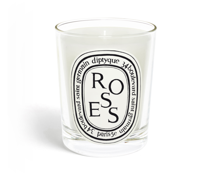 Rose scented candle in a clear glass vessel